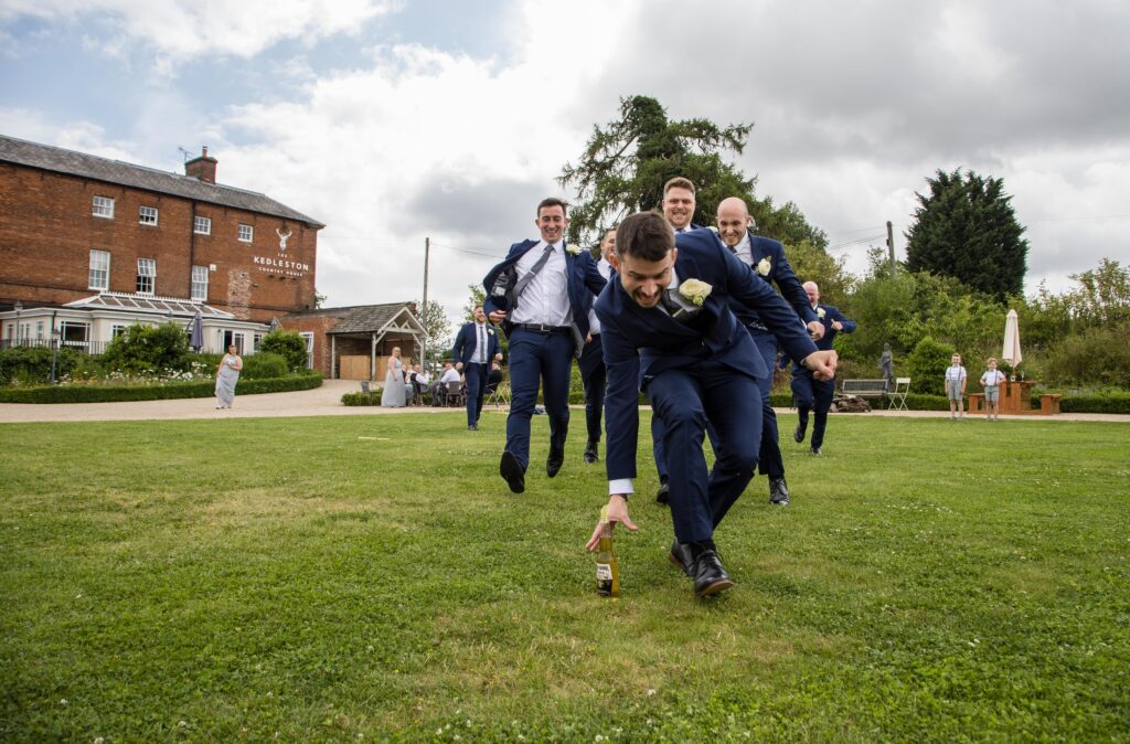 kedleston-derbyshire-wedding-groomsmen-beer-run-natural-photography